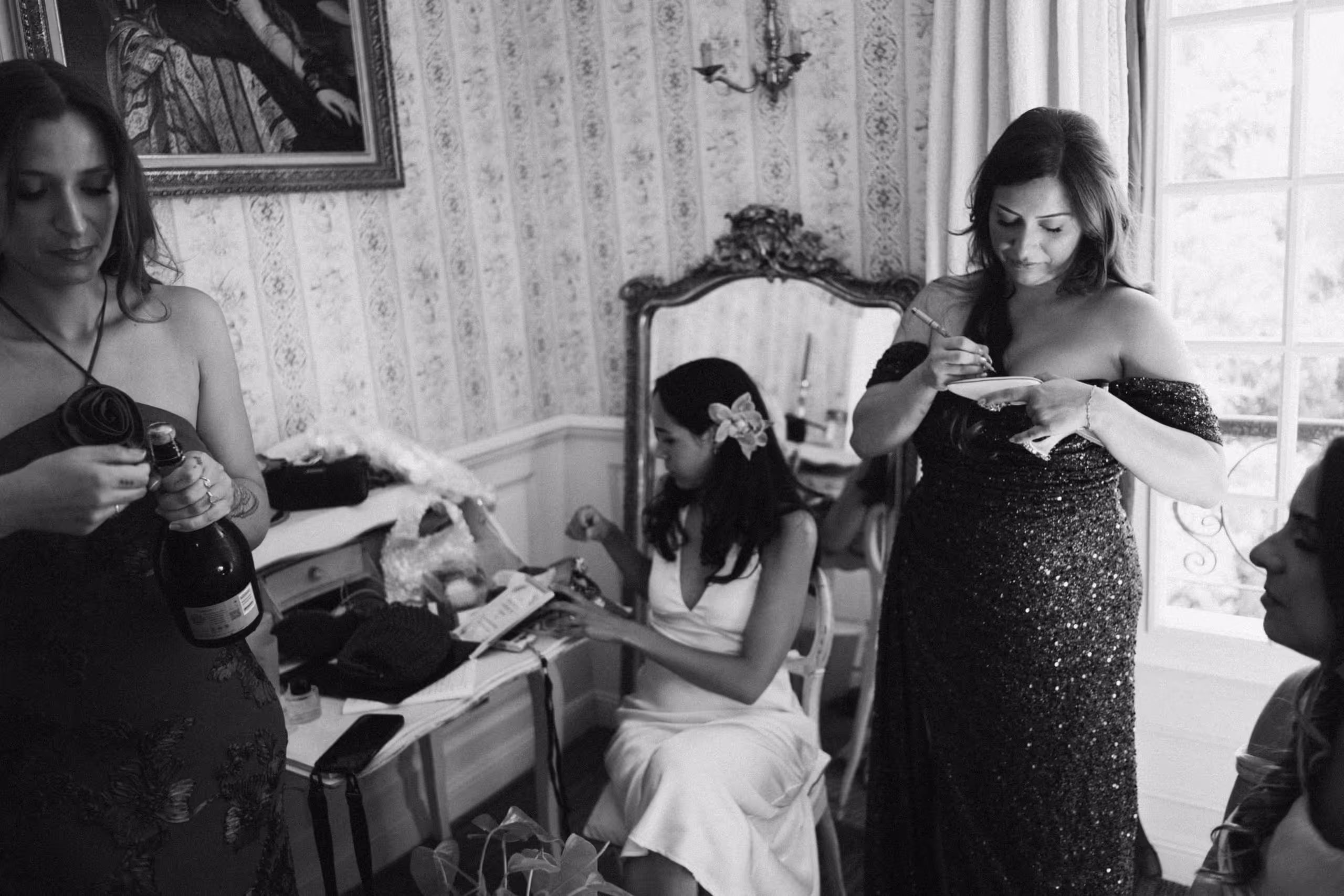 The bridal party getting ready, champagne poured in a chateau bedroom, bastide d'astres, provence wedding, south of france