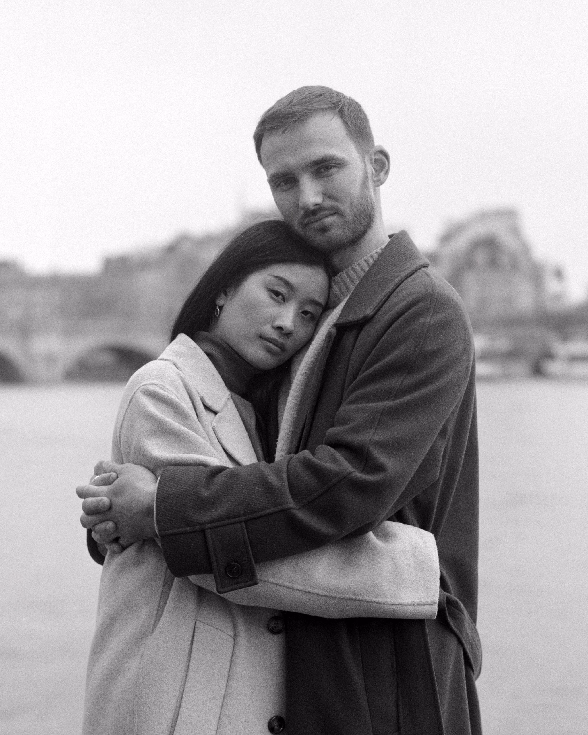 Couple portrait on the Quais de Seine, shot on black and white film, paris, engagement session, couple session, film photography, black and white