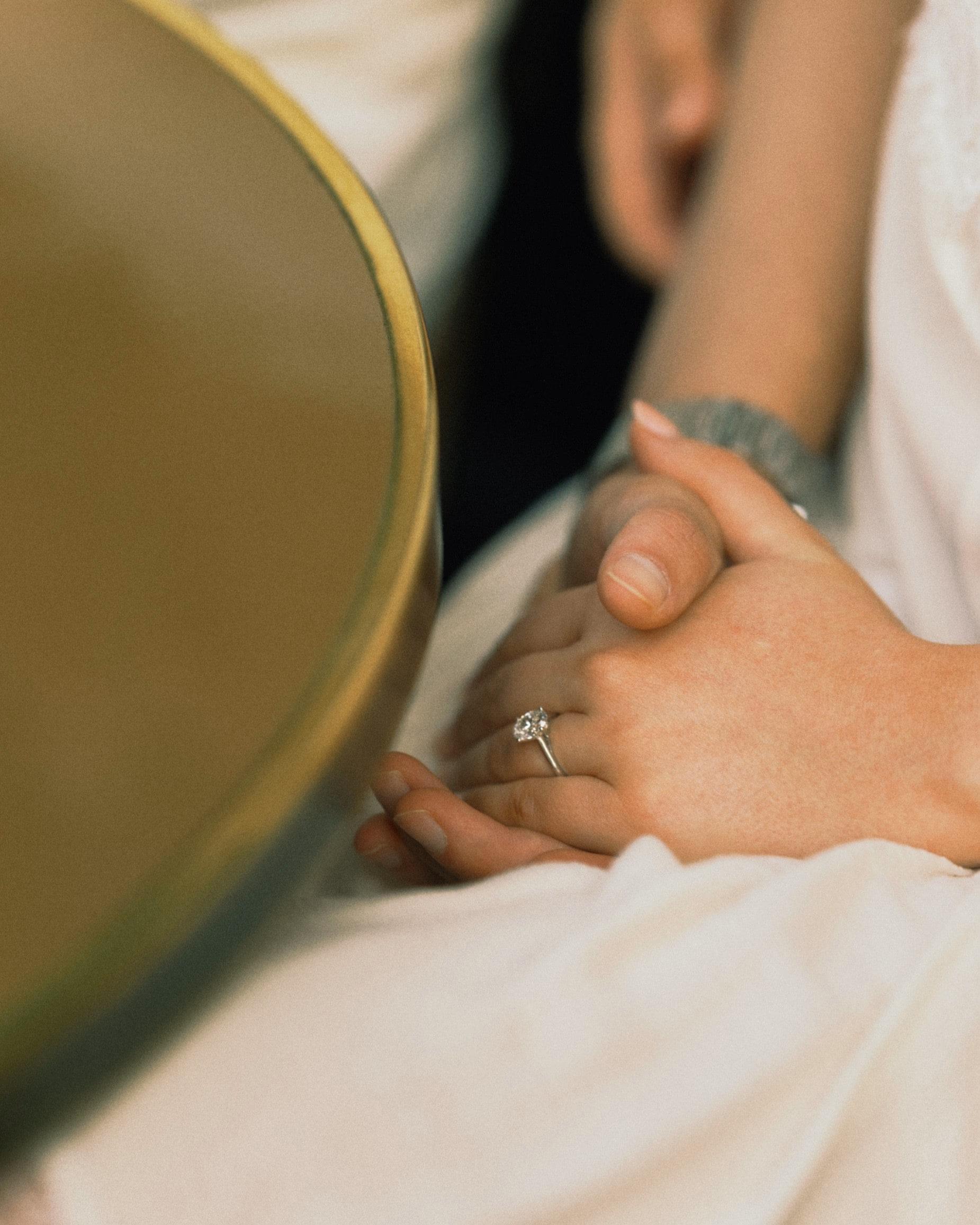 'romantic couple holding hand at a parisian cafe after an engagement photoshoot, montmartre, couple session