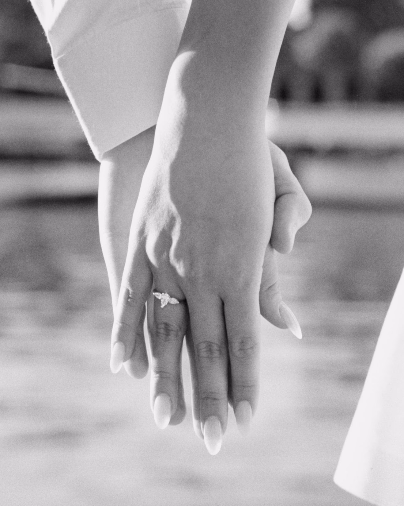 couple holding hand along the seine next to the eiffel tower after a proposal, paris, couple photography, shot on film, analog photography, black and white, proposal photography